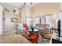 A bright and spacious living room features neutral colors, vaulted ceilings and an accent rug at 2246 Cassatt Dr, Henderson, NV 89074