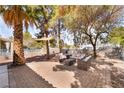 An inviting patio set, mature palms and shade are the highlight of this relaxing backyard at 2246 Cassatt Dr, Henderson, NV 89074