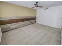 Bright bedroom with a modern accent wall and neutral carpet flooring at 2867 Geary Pl # 3008, Las Vegas, NV 89109