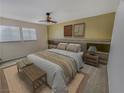 Inviting bedroom featuring a ceiling fan, coordinated decor, and natural light from two windows at 2867 Geary Pl # 3008, Las Vegas, NV 89109