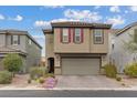 A well-kept two-story home with a neutral palette, two-car garage, and pleasant landscaping at 2945 Torreon Ln, Las Vegas, NV 89121