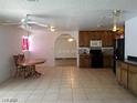 Bright living area boasts tile floors, lots of light, and a dining area at 3917 Acapulco Ave, Las Vegas, NV 89121