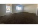 Bright living room features fresh paint, new carpet, and lots of natural light at 5129 Sugarfoot Ave, Las Vegas, NV 89107