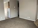 Inviting living room featuring neutral walls and comfortable carpeting, perfect for relaxation and entertainment at 6608 Elk Creek Ln, Las Vegas, NV 89156