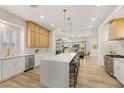 Bright kitchen with quartz island, stainless appliances, and wood cabinetry at 800 Jody Brook Ct, Las Vegas, NV 89145