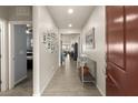 Bright foyer with wood-look tile flooring, neutral paint, and decorative accents. Perfect for welcoming guests at 896 Janefield St, Las Vegas, NV 89148