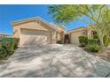 Home with desert landscaping, spacious driveway, and a two-car garage, plus additional garage space at 9108 Tuxpan St, Las Vegas, NV 89131