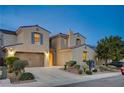 Beautiful two-story home with manicured landscaping, private drive and attached two-car garage at 1004 Bluebird Ridge Ct, North Las Vegas, NV 89084