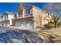 Inviting townhome with a two-car garage and landscaped front yard in a desirable neighborhood at 1595 Lefty Garcia Way, Henderson, NV 89002