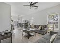 Bright and airy living room with neutral tones, modern decor, and ample natural light at 1595 Lefty Garcia Way, Henderson, NV 89002