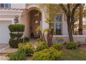 Inviting front entrance with stone walkway and mature landscaping for added curb appeal at 21 Ocean Harbour Ln, Las Vegas, NV 89148