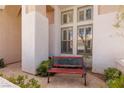 Charming front porch with bench seating perfect for relaxing and enjoying the outdoors at 21 Ocean Harbour Ln, Las Vegas, NV 89148