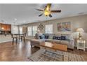 Comfortable living room has a ceiling fan, nautical-themed decor, and an inviting atmosphere at 2376 Via Firenze, Henderson, NV 89044