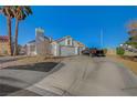 Charming single-story home featuring a three-car garage and well-maintained front yard at 2914 Luminous Ct, North Las Vegas, NV 89032