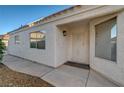 Welcoming home featuring a secure front door, stucco exterior, and neatly kept landscaping at 2914 Luminous Ct, North Las Vegas, NV 89032