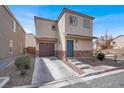 Charming two-story home with a welcoming blue door and low maintenance front yard at 4941 Quest Tribe St, Las Vegas, NV 89122