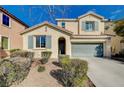 Lovely two-story home featuring well-maintained landscaping, a two-car garage, and a welcoming front entrance at 5652 Nobleton Ct, North Las Vegas, NV 89081