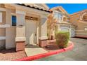 Charming condo entrance with a well-maintained walkway and manicured shrubs at 5855 Valley Dr # 2108, North Las Vegas, NV 89031