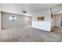 Spacious living room featuring neutral carpet, ample natural light and open floor plan at 5908 Gipsy Ave, Las Vegas, NV 89107