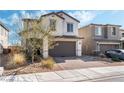 Beautiful home featuring a two-car garage and low maintenance landscaping at 7138 Superstar St, North Las Vegas, NV 89084