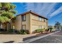 Corner of the building shows the exterior with landscaping and a sidewalk nearby at 7300 Pirates Cove Rd # 2087, Las Vegas, NV 89145