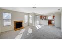 Spacious living room featuring fireplace, sliding glass doors, and an open kitchen at 7300 Pirates Cove Rd # 2087, Las Vegas, NV 89145