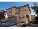 Two-story home with an attached garage, showcasing the front facade, landscaping, and a clear blue sky at 7731 Ornamento Way, Las Vegas, NV 89179
