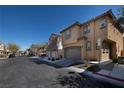 A street view of a two-story home with attached garage, landscaping, and nearby similar residences at 7731 Ornamento Way, Las Vegas, NV 89179