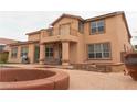 Spacious backyard with a pool, spa, covered patio, and outdoor seating area at 8070 Pavarotti Ave, Las Vegas, NV 89178