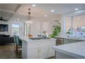 Bright, remodeled kitchen featuring a large island, modern appliances, and ample natural light at 8324 Slate Harbor Cir, Las Vegas, NV 89128