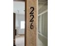 Condo number and corner of a room in the condo showing a fireplace and window at 8725 W Flamingo Rd # 226, Las Vegas, NV 89147
