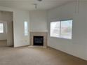 The living room boasts a fireplace and large window for natural light at 8725 W Flamingo Rd # 226, Las Vegas, NV 89147