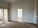 This room features carpeted floors and a glass sliding door leading to a balcony at 8725 W Flamingo Rd # 226, Las Vegas, NV 89147