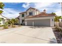 Charming two-story home featuring desert landscaping and a spacious three-car garage at 1600 Windsford Cir, Las Vegas, NV 89117