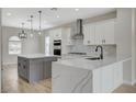 Modern kitchen features quartz countertops, stainless steel appliances, and a stylish center island at 2603 Savannah Springs Ave, Henderson, NV 89052