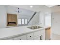 Open concept with a kitchen island connecting the kitchen to the living room at 2716 Ferrin Rd, Las Vegas, NV 89117