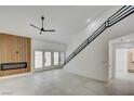 Spacious living room with a fireplace and natural light from French doors at 2716 Ferrin Rd, Las Vegas, NV 89117