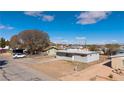A single-story home with chain link fencing, simple design, and a low maintenance yard at 352 Cox Ave, Overton, NV 89040