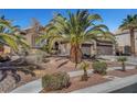 Charming single-story home with desert landscaping, tile roof, long driveway, and a three-car garage at 563 Moon Chase St, Las Vegas, NV 89110