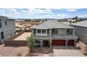Aerial view of the property showing desert landscape and beautiful two-story home at 7255 Bold Rock Ave, Las Vegas, NV 89113