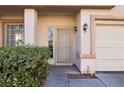 Inviting entrance with well-maintained landscaping and a charming front door, creating a warm welcome at 7925 Limbwood Ct, Las Vegas, NV 89131