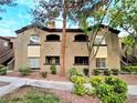 Attractive two-story condo with beautiful landscaping, sidewalk, and mature trees at 9000 S Las Vegas Blvd # 1187, Las Vegas, NV 89123