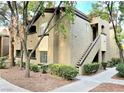 Attractive exterior with stairs, landscaping, and mature shade trees at 9000 S Las Vegas Blvd # 1187, Las Vegas, NV 89123