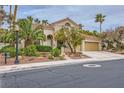 Attractive home with desert landscaping, a tile roof, and a two-car garage; neighborhood street view at 138 Wentworth Dr, Henderson, NV 89074