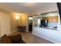 Living room is connected to the kitchen space that features a pass through at 1467 Hialeah Dr # D, Las Vegas, NV 89119