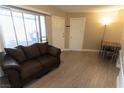 A living room featuring sliding doors that lead to a private patio or balcony space at 1467 Hialeah Dr # D, Las Vegas, NV 89119
