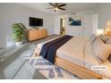 Relaxing main bedroom with modern decor, a ceiling fan, and a tiled floor create a peaceful retreat at 1575 W Warm Springs Rd # 1111, Henderson, NV 89014