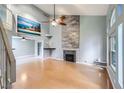 Spacious living room with high ceilings, fireplace, and lots of natural light at 2836 Floral Peak Dr, Henderson, NV 89074