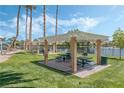 Community picnic area featuring tables, barbeque pits, and views of the picturesque lake at 3151 Soaring Gulls Dr # 1049, Las Vegas, NV 89128