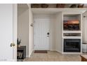 Inviting entryway featuring built-ins, a fireplace, and a stylish console table at 405 Paradise Pkwy # 170, Mesquite, NV 89027